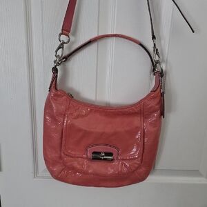 Coach Kristin Patent Leather Hobo Bag in a coral- Minor Color Transfer.